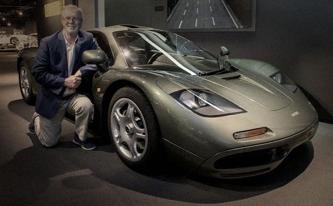 Peter Stevens kneeling beside the McLaren F1