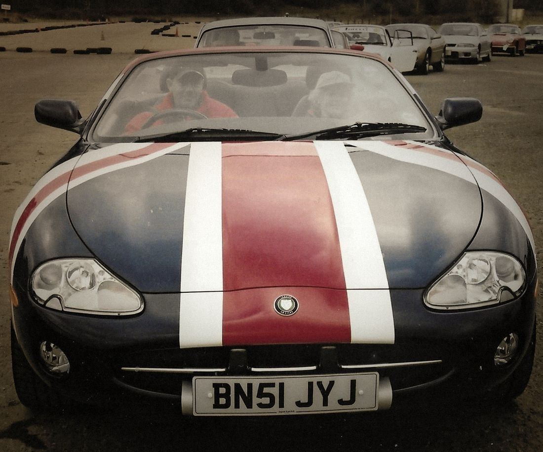 A Jaguar XK8 convertible with a Union Jack bonnet